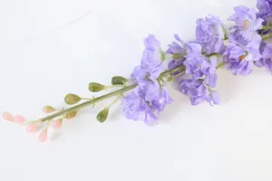 Close-up detail of artificial purple delphinium flower stem, realistic decor botanical accent