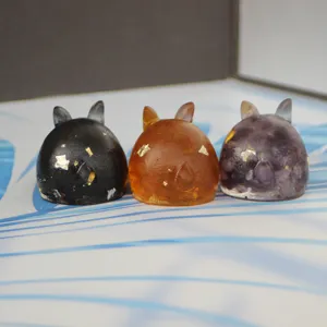 Detailed view of cute handmade resin crystal rabbit figurine featuring shiny gold flakes.