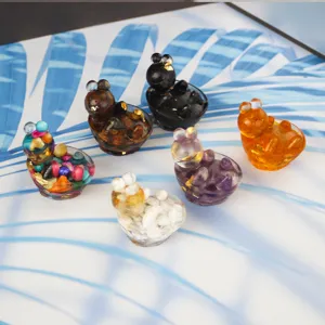 Close-up details of assorted resin crystal animal ornaments, perfect for cute desktop display.