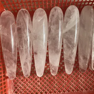 Natural clear quartz crystal massage wand for wellness and personal care detail view.