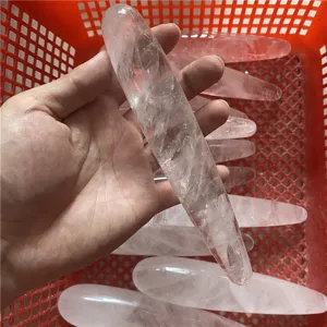 Natural quartz crystal massage wand detail view, smooth surface, perfect for body relaxation.