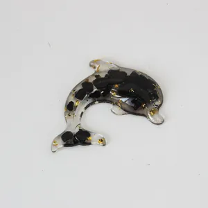 Resin dolphin figurine with gold foil and black stone flakes for DIY jewelry and crafts decor