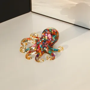 Detailed close-up view of the colorful resin octopus figurine filled with crystal crushed stones.