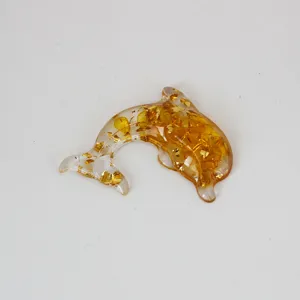 Natural crystal resin dolphin ornament with gold flakes, perfect accessory for DIY crafts.