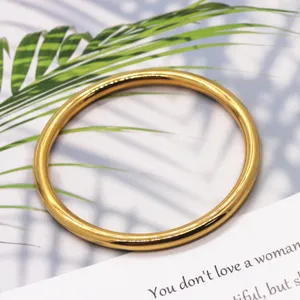 Detailed view of the solid gold-plated brass plain round bangle, elegant jewelry accessory.