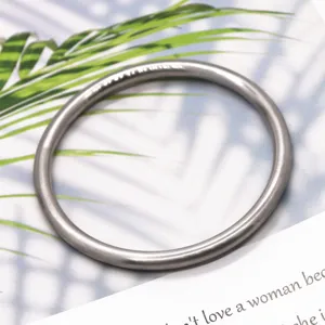 Solid matte plain gold bangle bracelet, classic minimalist jewelry design for everyday wear.