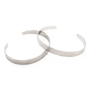Textured stainless steel open cuff bracelet with hammered matte finish detail shot.