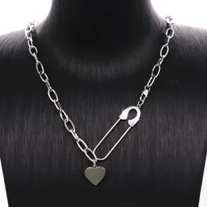 Detailed view of trendy geometric heart safety pin necklace in titanium steel style for women.