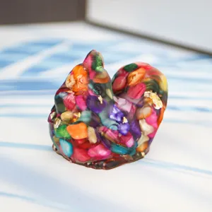 Detailed view of colorful resin crystal chicken figurine desk ornament with stones