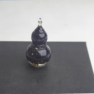 Mini blue goldstone epoxy gourd figurine detail, sparkling gold flakes desktop craft decor.