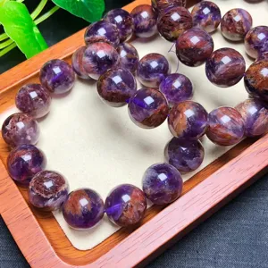 Natural purple ghost crystal bead bracelet detail, gorgeous red and purple mineral inclusions.