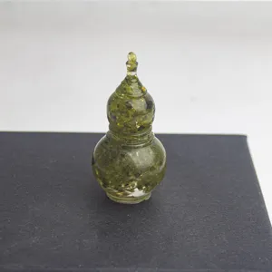 Detail view of a handcrafted crystal gravel epoxy gourd ornament, crystal clear design.