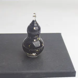 Epoxy mini gourd ornament with gold flakes for desktop decor, micro landscape and craft gift.