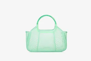 Green PVC mesh jelly bag detail, translucent texture and woven grid design showcase craftsmanship.