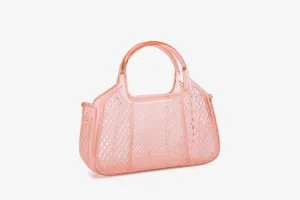 Transparent pink PVC jelly handbag mesh detail close-up, lightweight summer commuting style.