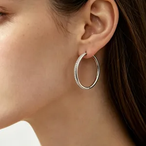 Elegant pavé diamond hoop earrings for women, stylish gold-plated stainless steel round jewelry.