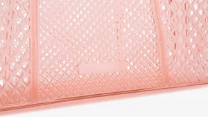 Pink transparent PVC jelly bag detail, stylish diamond mesh design for summer commuting.