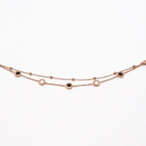 Close-up detail of the double-layer rose gold titanium steel bracelet with chic circles.