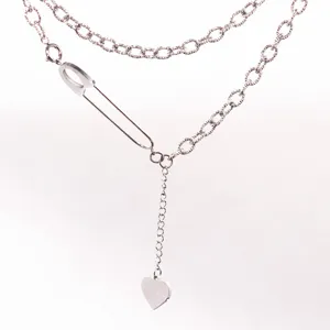 Silver titanium steel safety pin Y-shaped necklace with heart pendant, minimalist style.