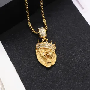 Gold lion head crown pendant necklace, hip hop style with sparkling cubic zirconia stones.