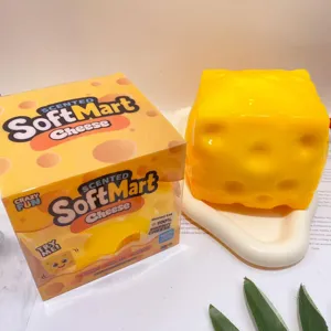 Detailed view of cute yellow cheese squishy toy, soft stress relief toy with scented box packaging.