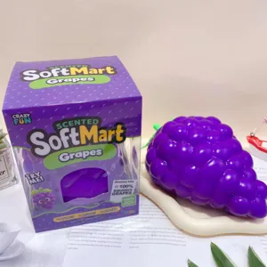 Close-up detail of the cute purple grape squishy toy showing its textured grape design clearly.