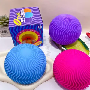 Detail view of colorful wave squeeze balls with packaging box, soft stress relief toy.