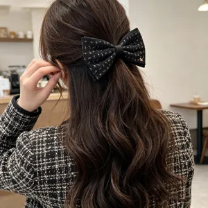 Retro floral bow hair clip with cute puppy charm, stylish vintage hair accessory for women.