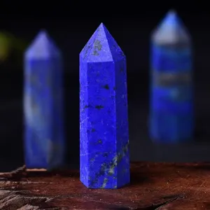 Detailed view of natural lapis lazuli crystal tower point, showcasing deep blue mineral texture.