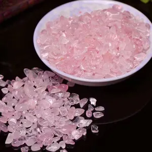 Close-up detail of natural pink crystal chips, raw quartz gravel for DIY crafts and jewelry decor.