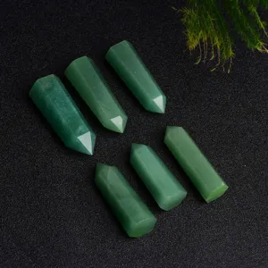 Green aventurine crystal column detail shot, single point hexagonal pillar stone ornament.
