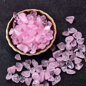 Natural rose quartz crystal chips, raw gemstone fragments for jewelry making and craft decor.