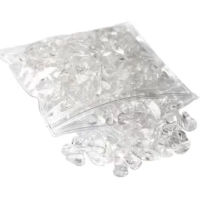 Natural clear quartz crystal chips in a transparent ziplock bag for healing, home decor, and DIY crafts.