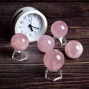 Natural rose quartz crystal sphere detail showcasing polished pink stone texture and clarity.