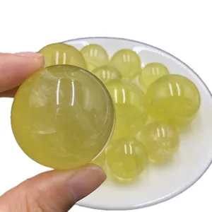 Natural citrine crystal ball sphere gemstone for home decor and healing meditation display.