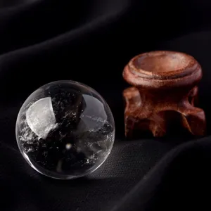 Natural clear quartz crystal ball sphere with wooden base for home office decor display