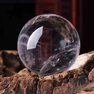 Clear quartz crystal sphere close-up, natural stone home decor crystal ball detail shot.