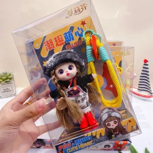 Cute trendy vinyl doll pendant keychain bag charm with fashionable clothes and colorful rope toy.