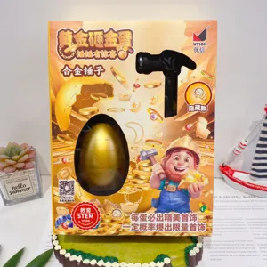 Detailed view of the golden egg smashing toy box including alloy hammer and blind box jewelry.
