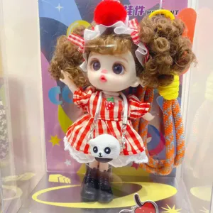 Cute trendy toy vinyl doll pendant with curly hair, red plaid dress, and delicate details.