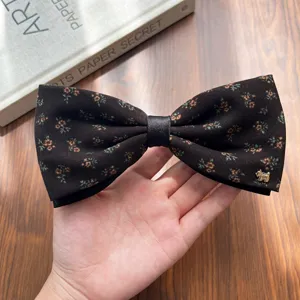 Retro puppy floral bow ponytail clip detail view, elegant fabric hair accessory for women.