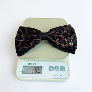 Leopard print bow hair clip with cute dog charm, stylish elegant spring clip for women