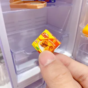Miniature refrigerator blind box toy detail showing cute mini food model packaging box and accessories.