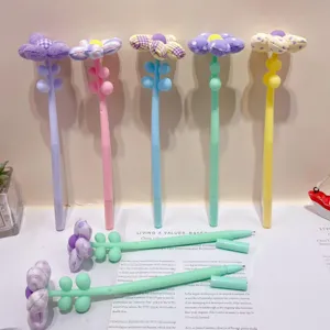 Detailed shot of cute dopamine color plush flower pens, colorful floral stationery display.