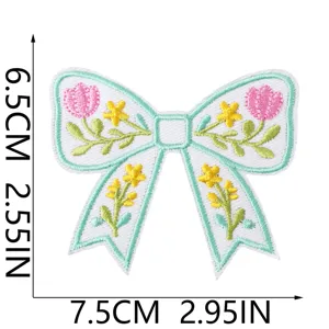 Embroidered bow patch detail featuring cute floral and tulip motifs with clean stitching.