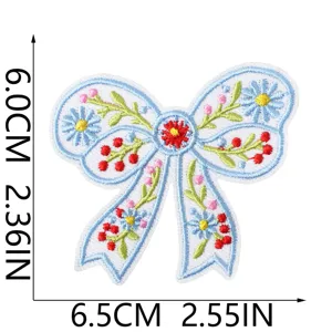Detailed view of the embroidered floral bow patch, highlighting exquisite stitching and exact size.