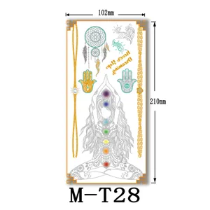 Metallic temporary tattoo sheet featuring yoga figures, dreamcatchers, and gold chains.