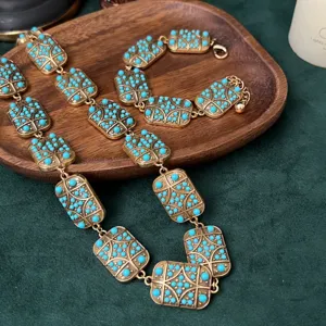 Vintage turkoois geometrische schakelketting en armband set, elegante goudkleurige sieraden.