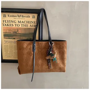 Vintage brown suede tote bag for women, large capacity shoulder commuting bag with cute bear charm.