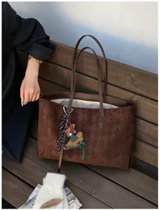 Retro brown suede tote bag, large capacity shoulder handbag with chic pendant for women.